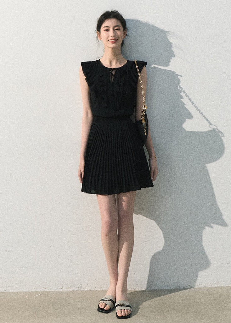 Sleeveless chiffon dress available in white and black