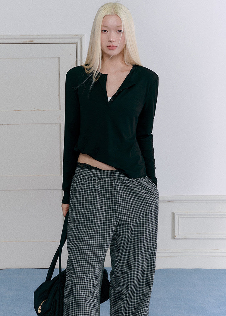 Relaxed black wool-blend Henley shirt styled with plaid pants