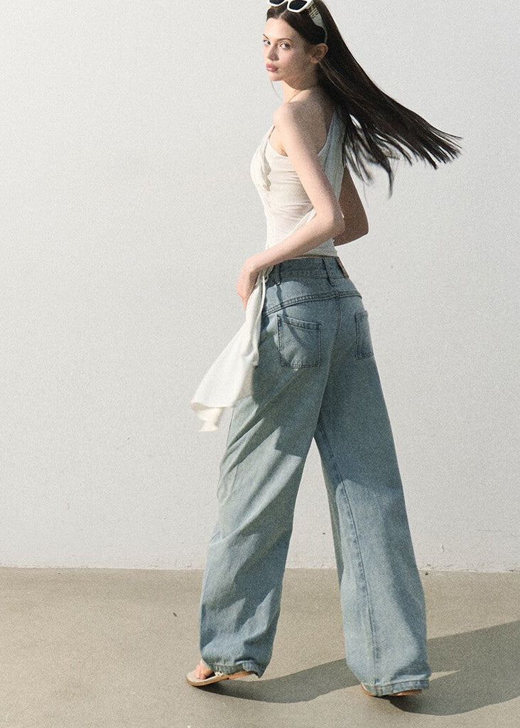 Soft asymmetrical shoulder top styled with relaxed blue jeans