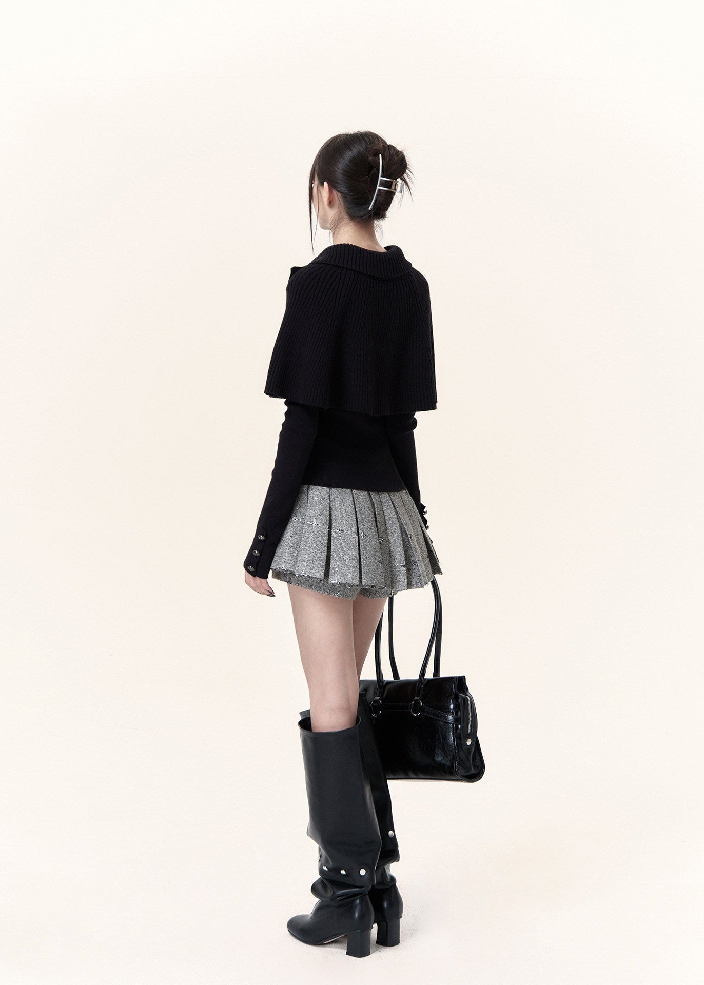 Black asymmetric cape layered knit top with button-detail neckline