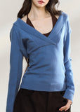 Blue asymmetric knit top with a wide foldover neckline