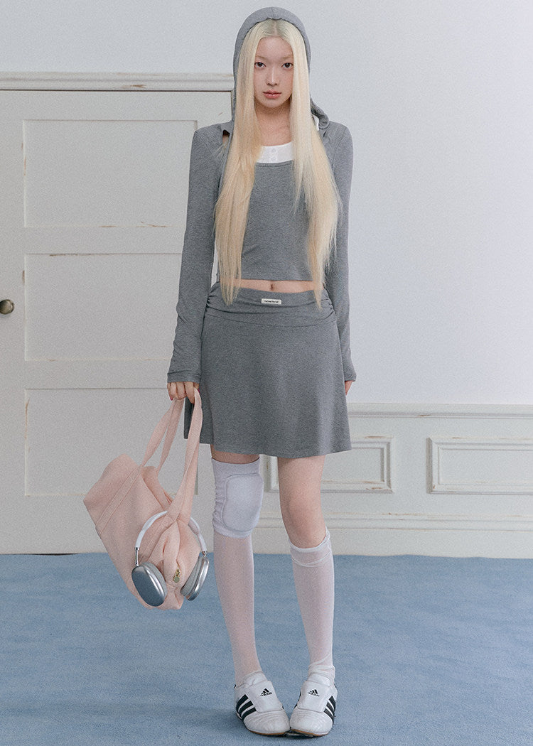 Faux two-piece long-sleeve top with contrast neckline and gray mini skirt