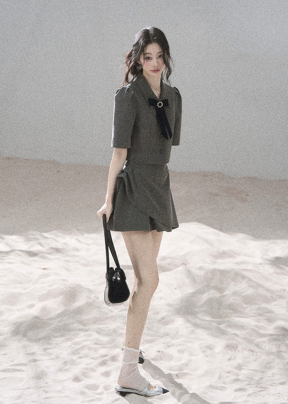 Gray tailored blazer skirt set with softly structured shoulders