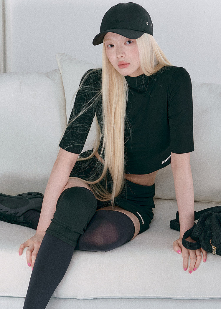 Women’s black cropped mock-neck top and mini skirt matching set