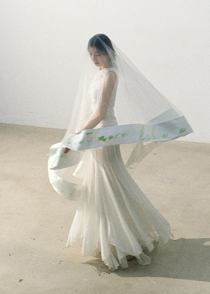 Flowing long skirt paired with a draped sleeveless top