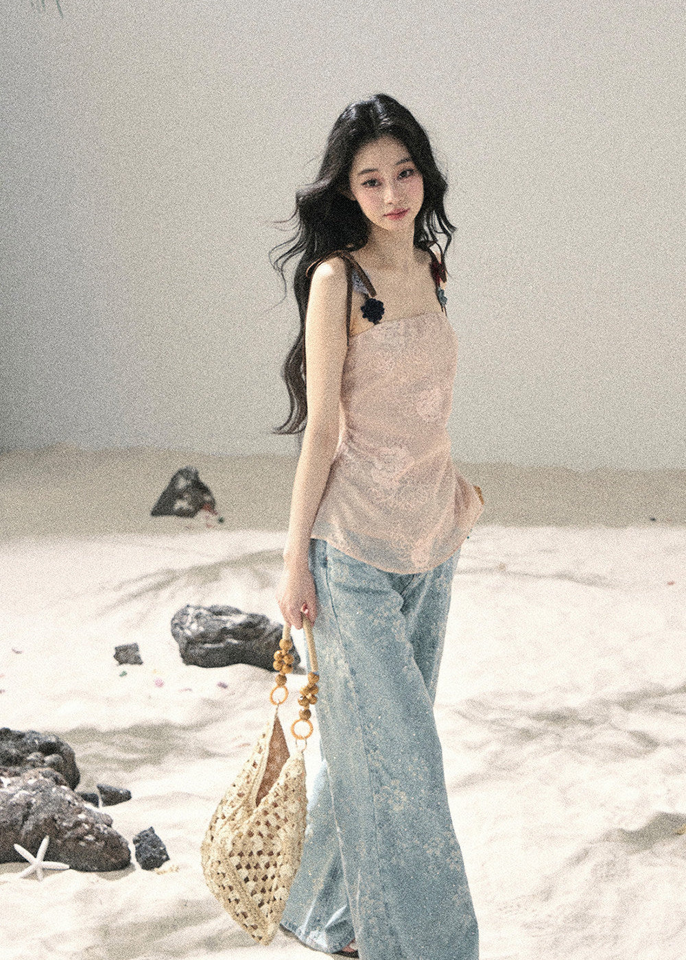 Embellished floral jeans styled with a white lace crop top