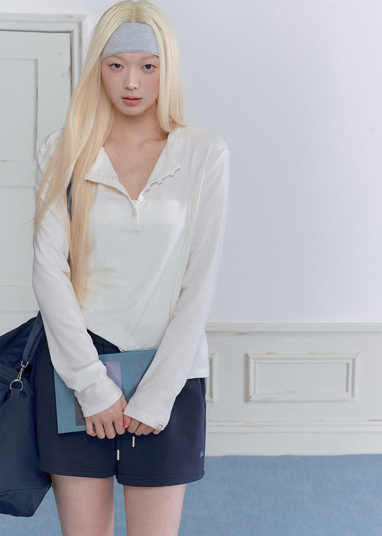 Relaxed navy sweatsuit with embroidered chest detail and drawstring waist