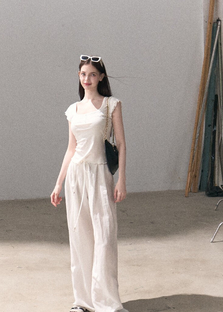 Short-sleeve U-neck top with subtle embroidery