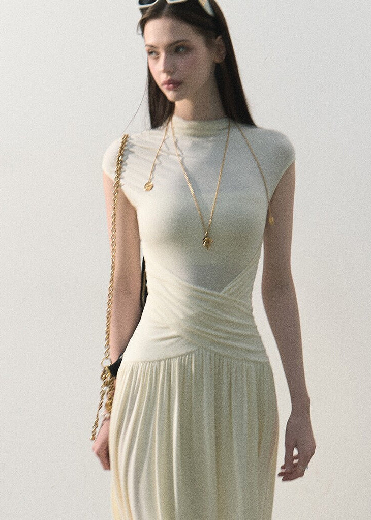 Draped waist long dress styled with a shoulder bag