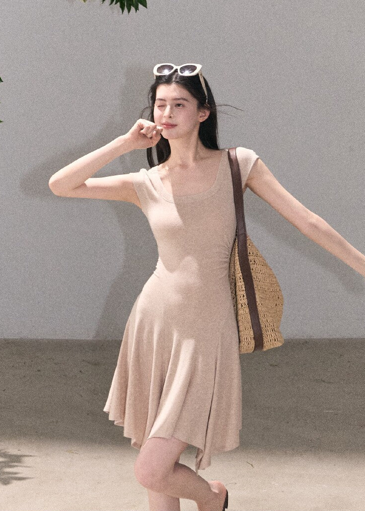 Soft green sleeveless midi dress with elegant drape