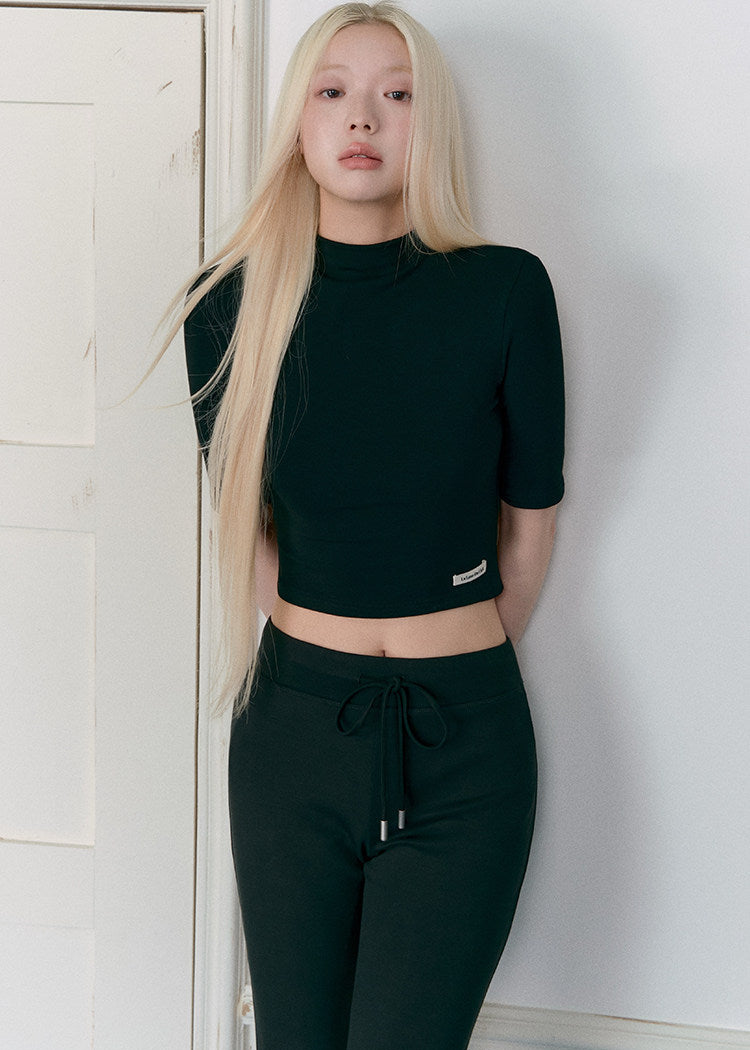 Women’s black cropped mock-neck top and mini skirt matching set