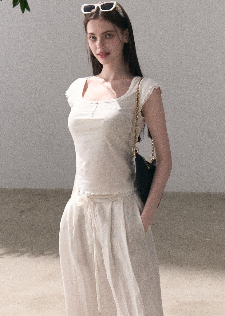 Short-sleeve U-neck top with subtle embroidery