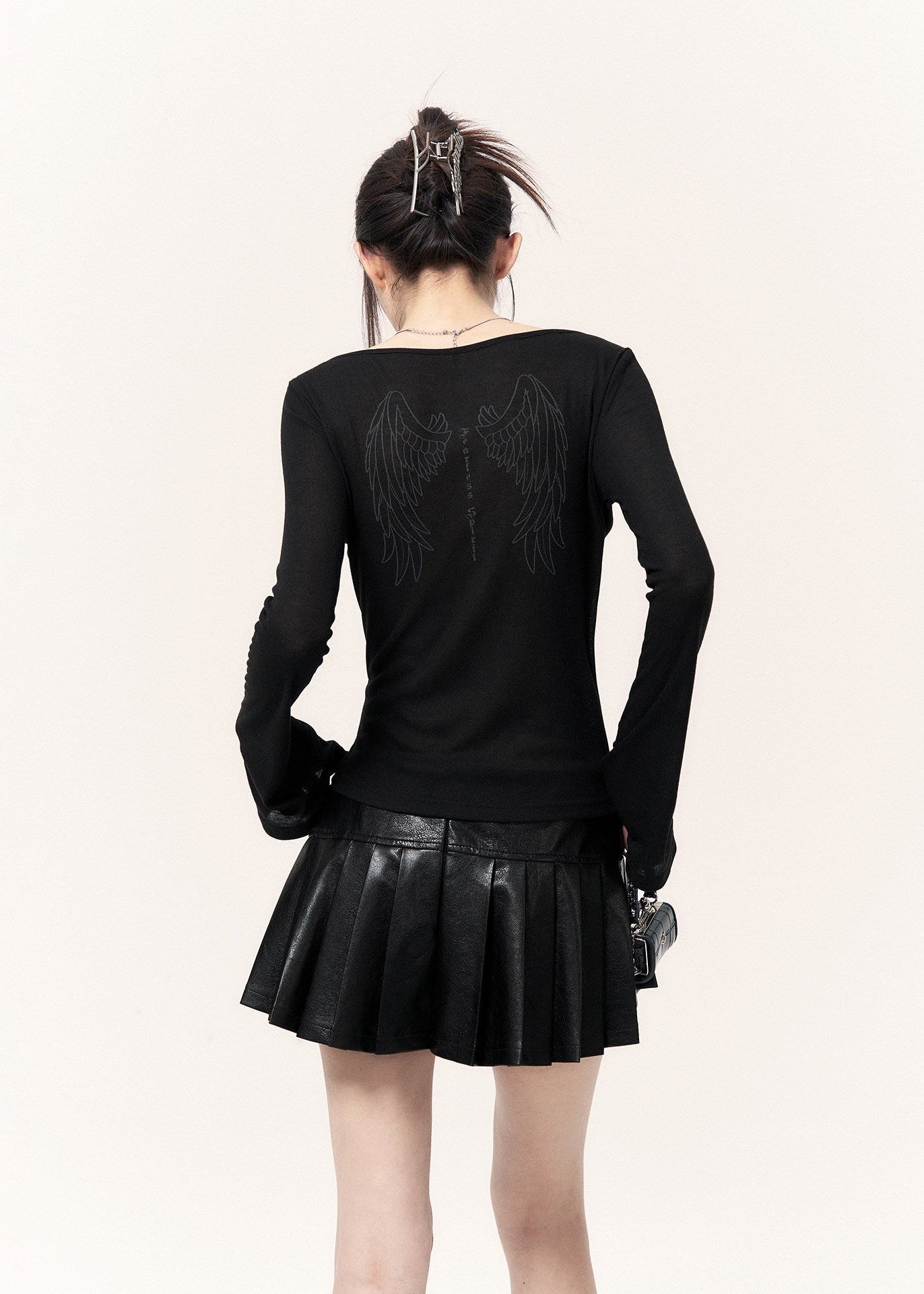 Black Y2K mini skirt with a glossy finish and built-in bloomers