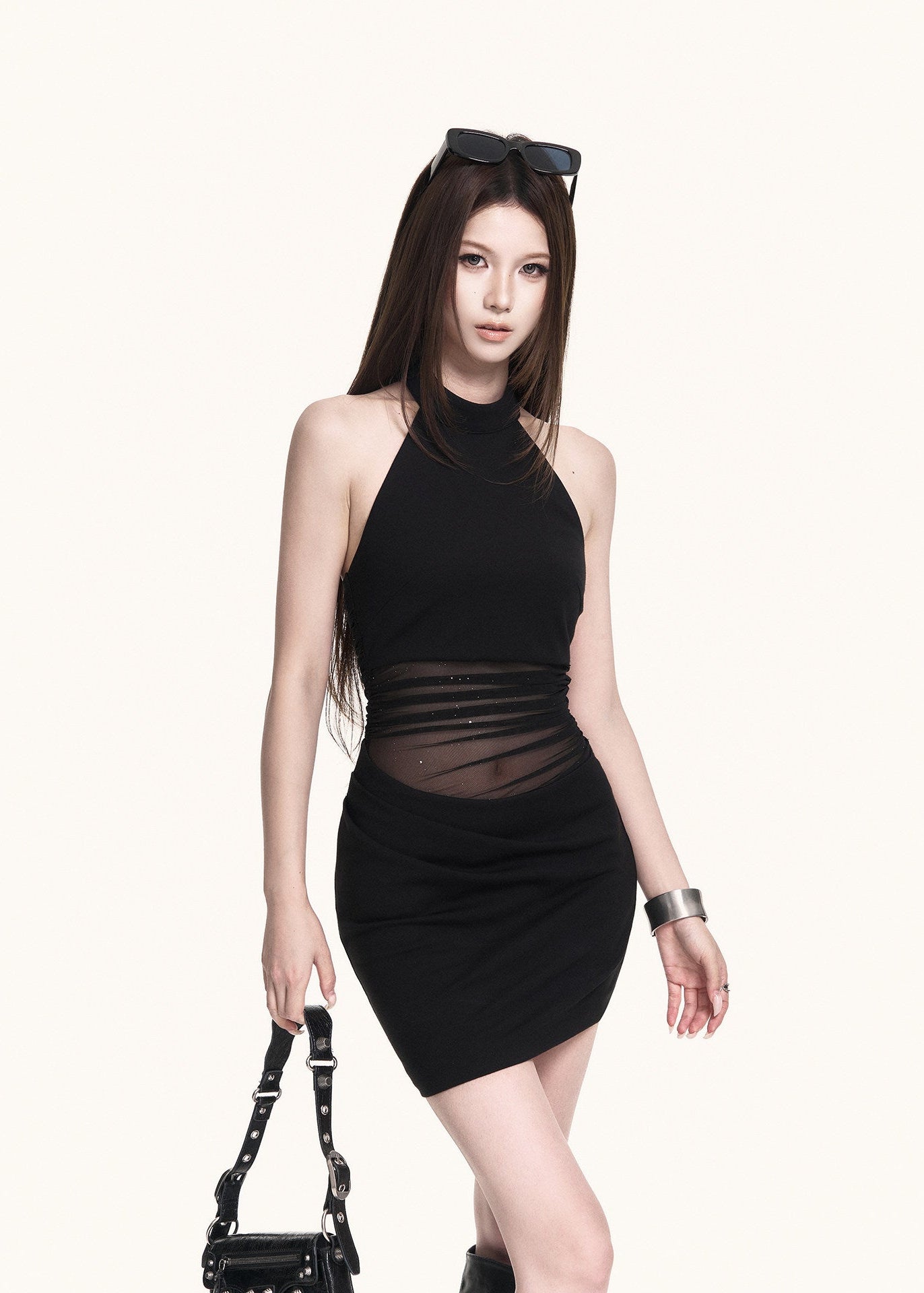 Black fitted party dress with a sheer waist design