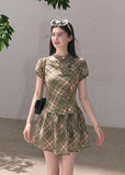 Green plaid mini dress with button detail