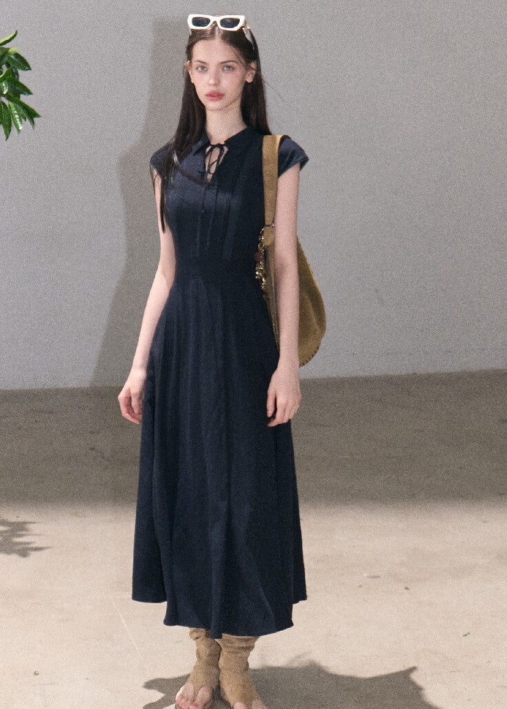 Long navy blue collared dress with fitted waist