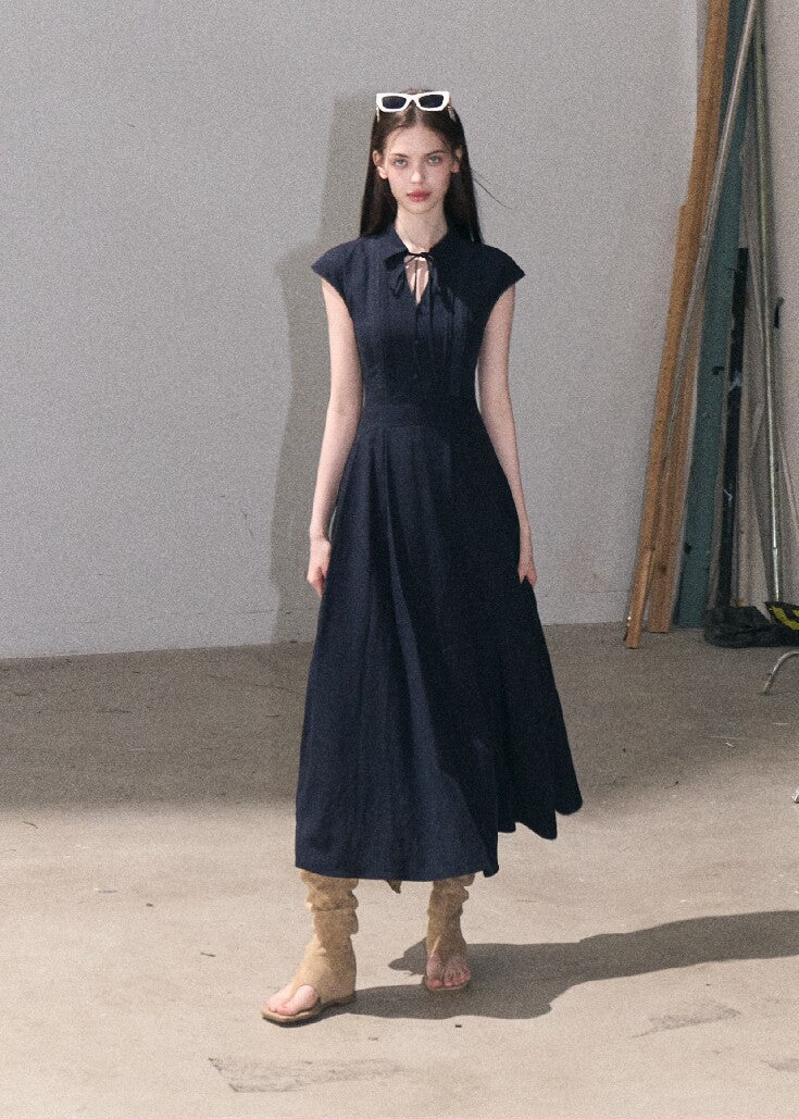 Long navy blue collared dress with fitted waist
