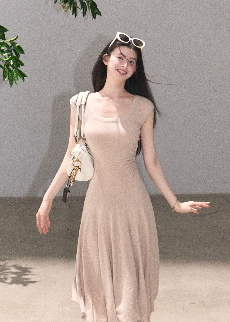 Slim fit sleeveless dress with soft flowing skirt